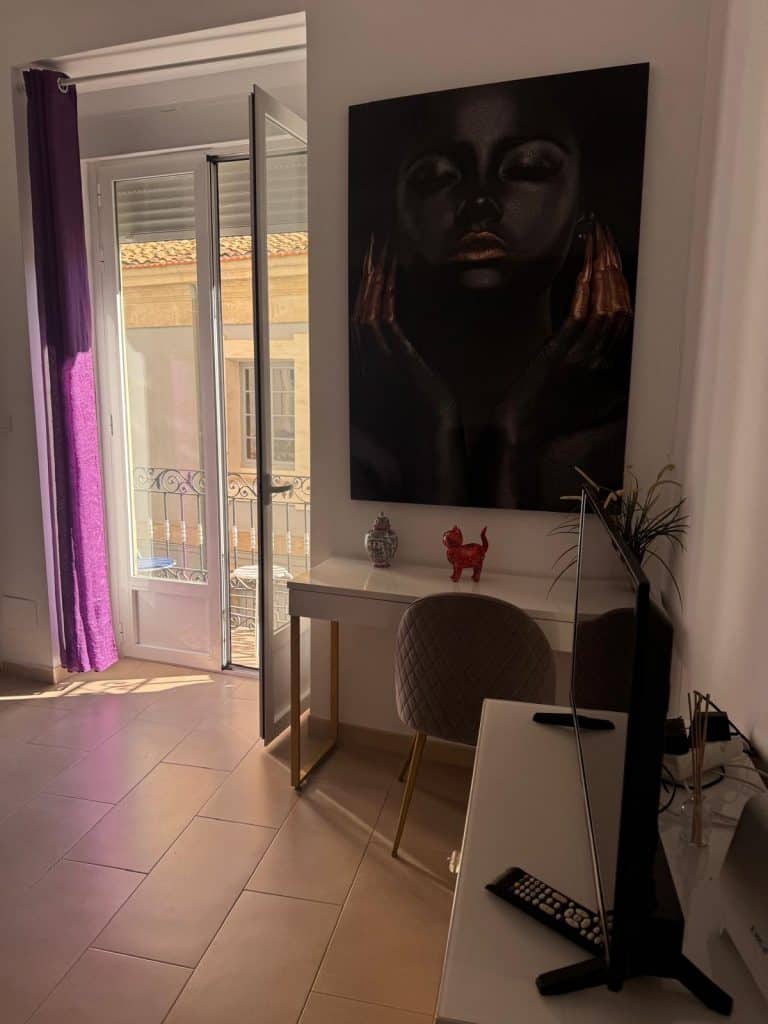 “Bright and modern living room in Alicante vacation apartment.