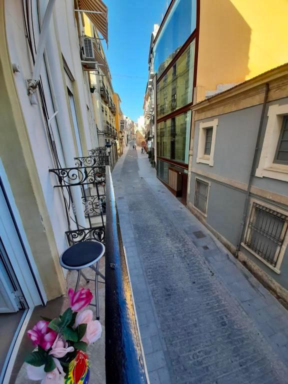 “Outdoor balcony area with urban views – Alicante holiday apartment”